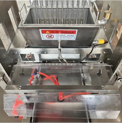 I negozi di alimenti e bevande beneficiano di una macchina semiautomatica per versare caramelle morbide e dure
